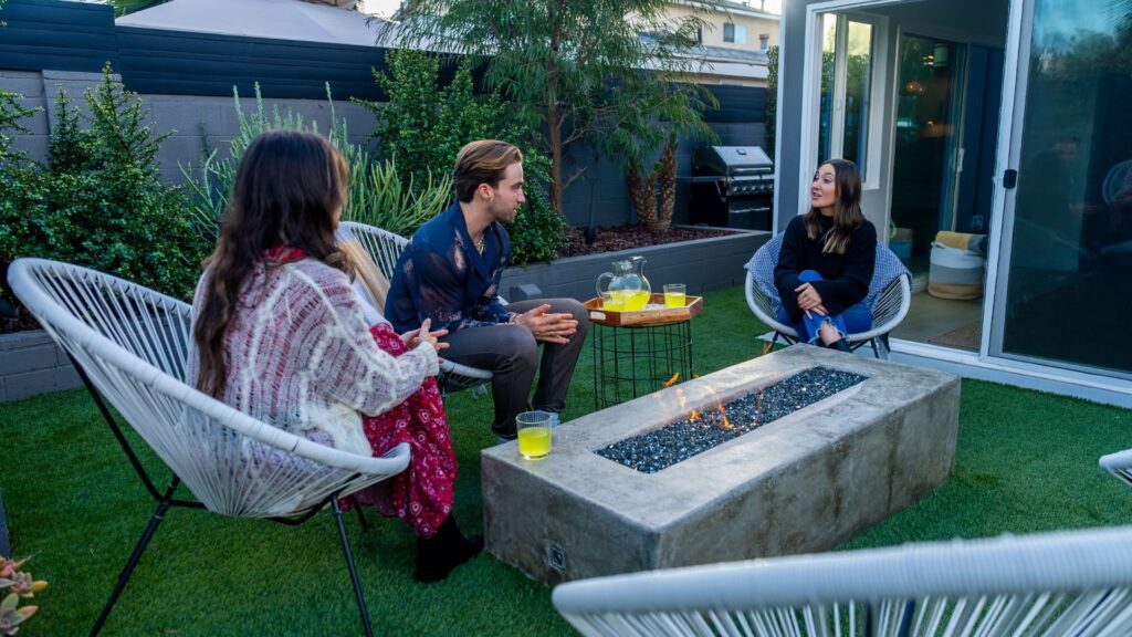 a photo of friends enjoying an artificial grass back lawn