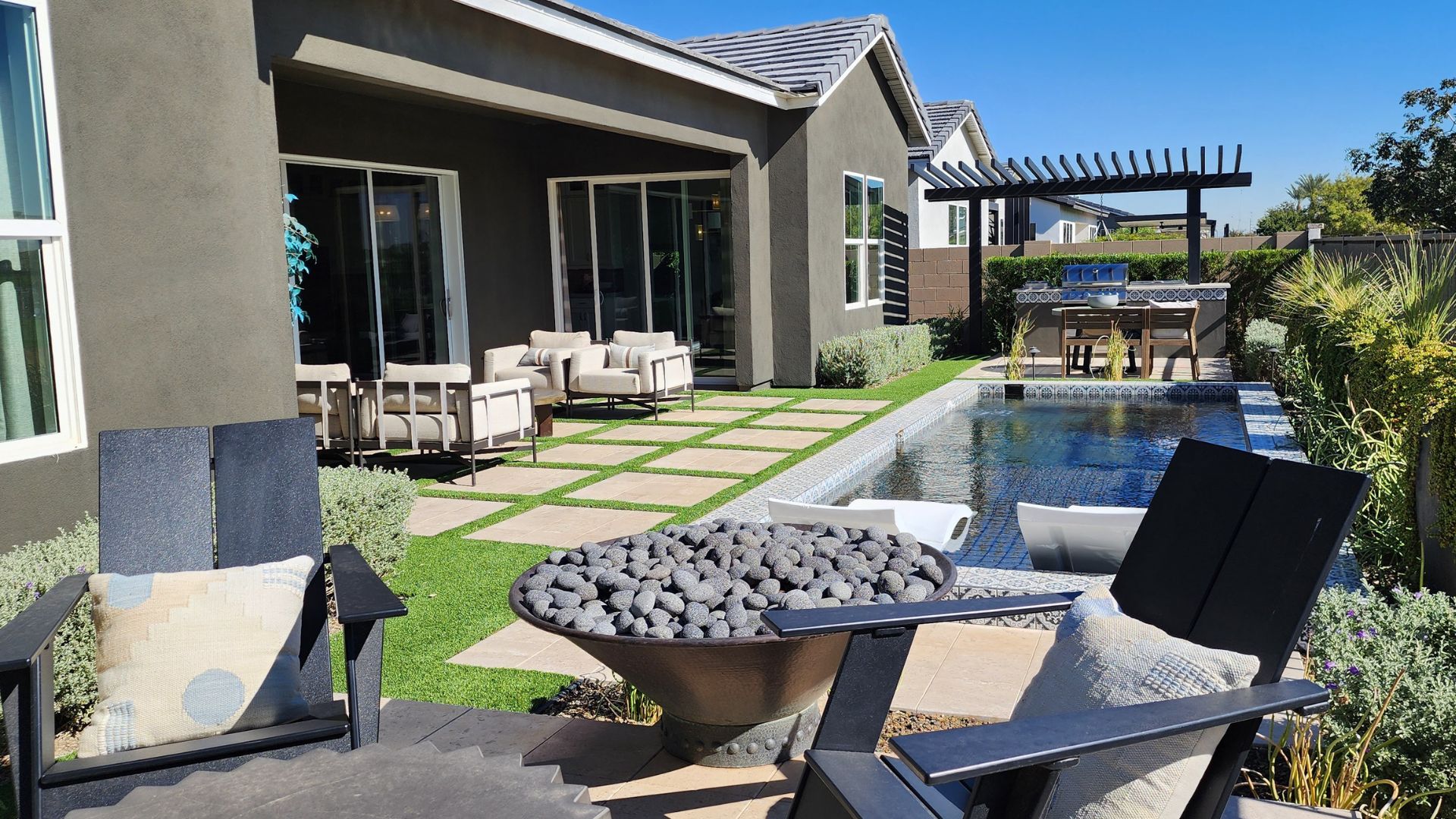a luxury home backyard with turf provided and installed by Artificial Turf Supply