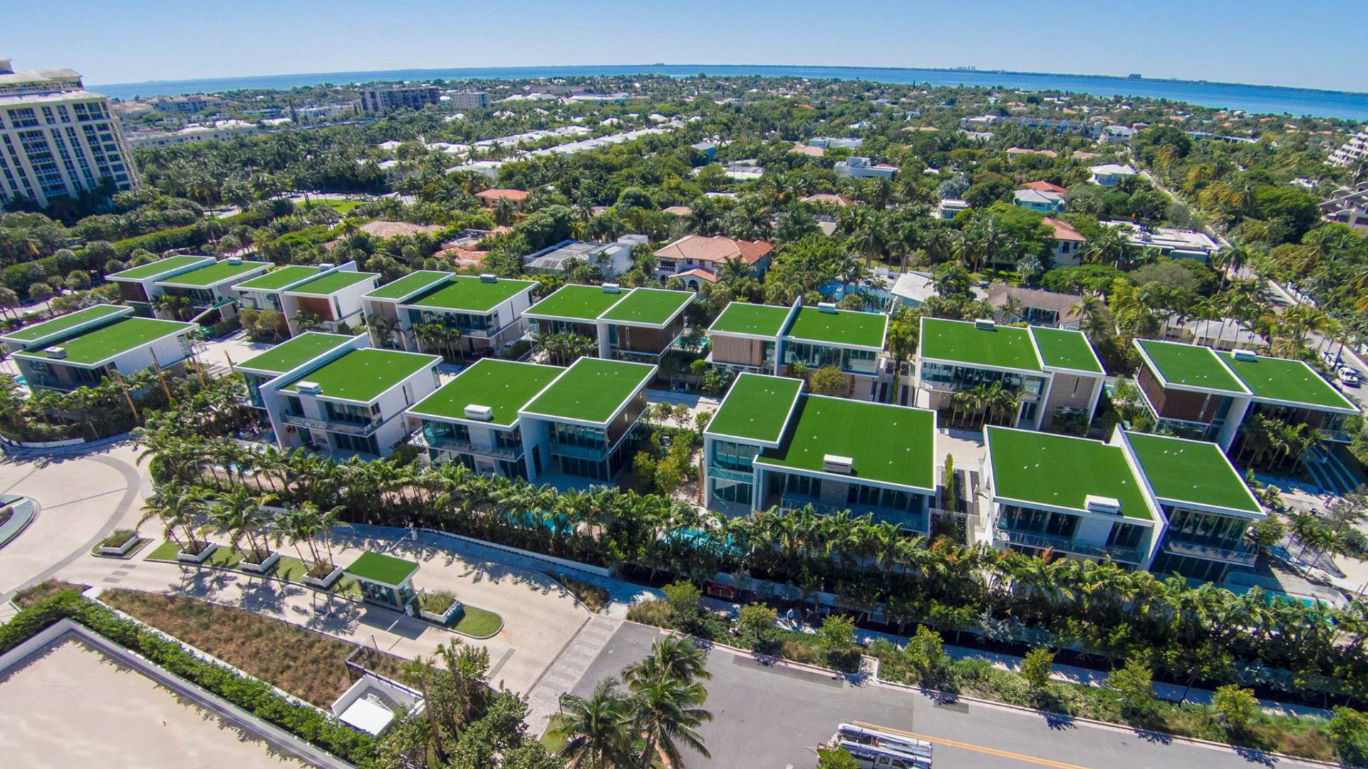 an aerial photo of a west coast apartment complex with synthetic turf on the roofs to create usable outdoor spaces